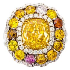 Stunning Cushion Cut diamond ring with center GIA Certified 3.02 Fancy Brownish Yellow, VS1 in Clarity, set with 4.12 Carats of Natural Fancy Color Diamonds, Natural Pink, Yellow, Cognac, white and orange diamonds. All round brilliant cut diamonds. Coloured Diamonds, Pink Diamond Jewelry, Radiant Cut Diamond Ring, Canary Diamond, Brilliant Cut Diamond Ring, Cushion Cut Diamond Ring, Diamond Rings With Price, Emerald Cut Diamond Engagement, Emerald Cut Diamond Ring