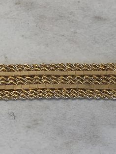 "This one-of-a-kind custom-made 14kt Yellow Gold Lady's Bracelet consists of 6- 1mm Solid Rope Chains and 2 Mirror Shiny Box Chains soldered together to create this unusual pattern style 7\" in length. This bracelet has a hidden solid box clasp with a secure fig 8 safety clasp. This bracelet weighs 14.5 grams. This item would Retail for $2,280.00" Gold Bracelet With Decorative Band As Gift, Gold Bracelets With Decorative Band As Gift, Gold Bracelet With Decorative Band For Anniversary, Formal Yellow Gold Bracelet With Decorative Band, Rectangular Gold Bracelet With 17 Jewels, Gold Rectangular Chain Bracelet For Formal Occasions, Collectible Gold Jubilee Bracelet Jewelry, Yellow Gold Rectangular Bracelet For Anniversary, Yellow Gold Bracelet For Anniversary