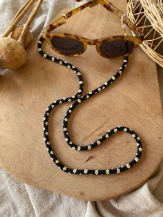 Handmade glasses chain or necklace  I string the beads one by one and then knit them. It is not gluing. Handmade Black Necklaces For Summer, Handmade Black Necklace For Summer, Trendy Black Glasses Chains For Gift, Summer Gift Black Glasses Chains, Gift Black Beaded Glasses Chains, Adjustable Black Beads Glasses Chains For Gift, Black Beaded Glasses Chains As Gift, Adjustable Black Beads Glasses Chains As Gift, Black Round Beads Glasses Chains As Gift