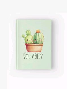 a green book with two small cactuses on it and the words soil mates written in black