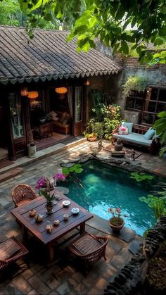 an outdoor dining area next to a swimming pool