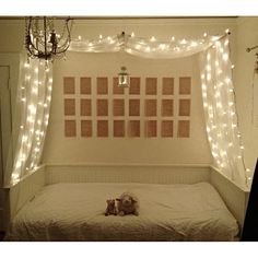 there is a bed with lights on the wall