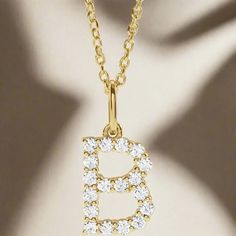 Personalized sparkle! Crafted with precision and elegance, our Diamond Initial Pendant features a 14K solid gold design and sparkling lab-grown diamond accents. Pick between rich yellow gold or sparkling white gold. This necklace is 18" with a jump ring at 16" for adjustability. Add a personal touch with your or a loved one's initials to any outfit and stand out with this luxurious personalized piece. Yellow Gold Diamond Initial Necklace For Gifts, Yellow Gold Diamond Initial Necklace As Gift, Diamond Initial Necklace In Yellow Gold For Gift, Gold Jewelry With Vvs Clarity Lab Grown Diamonds, Gold Lab Grown Diamond Cut Jewelry, Dazzling Gold Moissanite Necklaces, Yellow Gold Moissanite Round Pendant Necklace, Fine Jewelry With Lab Grown Diamond In Gold, Gold Lab Grown Diamond Necklace For Formal Occasions