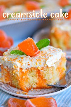 a close up of a piece of cake on a plate with a fork and orange slices