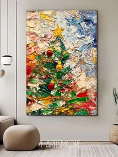 an abstract christmas tree painting hanging on the wall