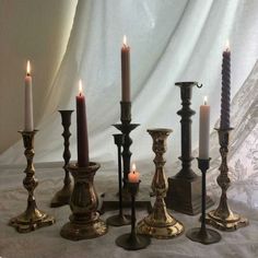 there are many candles that have been placed in the middle of each candle holder for display