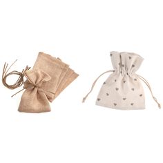 two small bags with hearts on them sitting next to each other in front of a white background