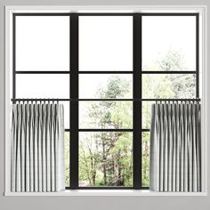 an open window with white curtains and trees in the background