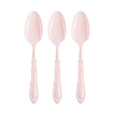 three pink plastic spoons sitting next to each other