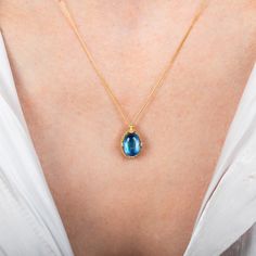 This iridescent Moonstone is formed into the shape of a small oval. We encased it in a handmade gold bezel with braided detail and prongs to showcase its swirling blue beauty. Technical Details Metal: 18k yellow goldMoonstone: 3.18 cts. Pendant Size (not including bail): 12mm x 9mmChain: can be worn at 16" and 18"Closure: lobster claspHandmade in New YorkStyle # N-3471-MO Blue Topaz Oval Cabochon Jewelry Gift, Gift Blue Topaz Oval Cabochon Jewelry, Yellow Gold Necklace With Oval Cabochon Birthstone, Blue Topaz Oval Pendant Jewelry, Elegant Jewelry With Blue Topaz Oval Cabochon, Elegant Blue Topaz Oval Cabochon Jewelry, Oval Sapphire Necklace With Cabochon Cut, Oval Sapphire Cabochon Necklace, Oval Blue Topaz Yellow Gold Jewelry