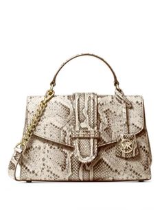 Pretty python-printed leather covers the Bleecker satchel for a seriously sophisticated take on a classic silhouette.Small sized bag 10"W x 6-3/4"H x 3-3/4"D (width is measured across the bottom of handbag)3"L handles; 22-1/2"L adjustable removable strapMagnetic flap closure18K gold-tone exterior hardware & 1 back slip pocket1 interior zip pocket & 1 slip pocketLeatherColor: Natural Python Print, Leather Satchel Bag, Purse Accessories, Mens Gift Sets, Vans Authentic, Satchel Handbags, Small Shoulder Bag, Handbags Michael Kors, Printed Leather