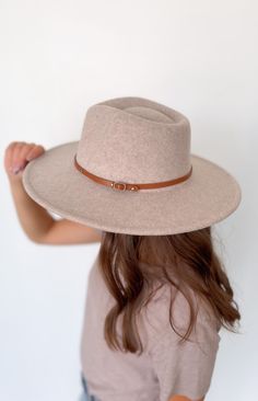 This wool wide brim hat with two interchangeable belts is the perfect addition to your wardrobe. Crafted from a wool blend, this stylish and timeless hat will elevate your look and give you a distinguished flair. Included with each hat are two belt color options: brown or black 10% wool, 90% polyester Felt Hat, Wide Brimmed Hats, Elevate Your Look, Brim Hat, Wool Hat, Wide Brimmed, Color Options, Wool Blend, Belts