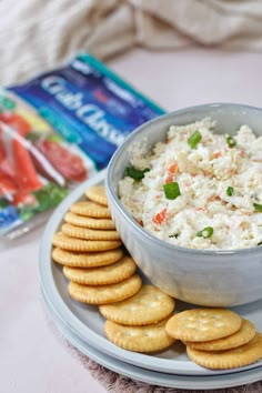 a plate with crackers and dip on it