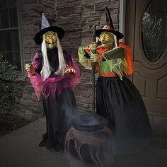 two people dressed up in halloween costumes standing next to each other on the front porch