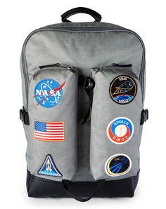 You’ll be ready for any out-of-this-world adventure when you sport this awesome NASA backpack! This officially licensed bag features six different patches embroidered on the front pockets and will have you feeling like a stylish space cadet in no time at all. Officially licensed Adjustable padded straps 2 water bottle pockets 2 outside zip pockets Outside Laptop pocket Zip-around and clip closure Material: Polyester Care: Spot clean Imported Sporty Backpack With Logo Patch, Back To School Travel Bags With Logo Patch, Backpack With Logo Patch For Outdoor Activities, School Backpack With Logo Patch, Outdoor Activities Backpack With Logo Patch, Sporty School Backpack With Multiple Pockets, Casual Embroidered Backpack, Nasa Patch, Space Cadet