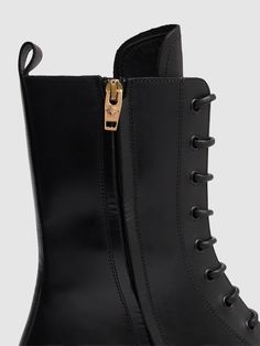 35mm Heel. Leather upper. Back pull loop. Front lace-up closure. Logo details. Treaded rubber sole Chunky Ankle Boots, Leather Combat Boots, Versace Logo, Black Boots Tall, Tall Leather Boots, Black Chelsea Boots, Leather Chelsea Boots, Heeled Loafers, Black Leather Boots