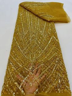 Fitted Embroidered Fabric With Rhinestones For Festive Occasions, Elegant Yellow Embroidered Fabric For Wedding, Festive Fitted Embroidered Fabric With Rhinestones, Gold Beaded Embroidered Fabric For Party, Gold Pearl Embroidered Fabric For Party, Luxury Gold Sequin Fabric For Evening, Gold Sequin Fabric With Pearl Embroidery For Party, Gold Embellished Embroidered Fitted Fabric, Gold Sequin Fabric With Rhinestones For Wedding