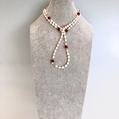 This Return to Origin pearl necklace set features multi-style natural baroque pearl lariat necklace with red silk tassels which can also be styled as earrings. Beaded baroque pearl necklace can be styled as rope necklace, lariat necklace, classic necklace, or even a bracelet. ⚜ Return to Origin Jade Beaded Necklace ❀ Natural Baroque Pearls 8-10mm❀ Red Carnelian 8mm❀ Gold Filled Link with Wire Wrapped Seed Pearls❀ Beaded Chain 42 in. with Glasses Chain Connectors❀ Multiple Styles ⚜ Red Silk Tasse Adjustable Handmade Red Pearl Necklace, Red Polished Beads Long Necklace, Luxury Handmade Red Pearl Necklace, Red Long Hand-strung Beaded Necklace, Luxury Red Hand-strung Beaded Necklaces, Jade Bead Necklace, Pearl Lariat Necklace, Pearl Lariat, Silk Tassels