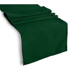 the green table runner is folded on top of each other and ready to be used