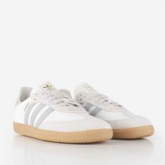 Elevate your street style with the Adidas Originals Samba OG Shoes in Off White/Grey Two/Alumina. These iconic low-profile shoes offer a modern twist on a retro style with a rich history inspired by indoor football. Crafted from nylon, a leather heel patch and stripes and a suede T-toe, the shoes also feature a textile lining, durable gum sole, and tonal lace closure. With decades of expertise moulded into the design, these shoes provide unparalleled agility and control to tackle whatever your d Teen Christmas Wishlist, Shoes Wishlist, Samba Og Shoes, Indoor Football, Fancy Accessories, Cute Sneakers