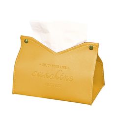 a yellow leather tissue dispenser with the words enjoy your life on it