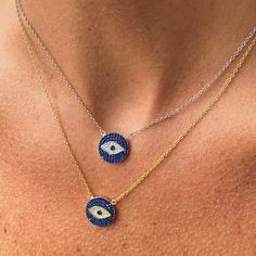 Our evil eye necklace is not only an ancient symbol of protection; but with its cubic zirconia detailing it is an on-trend fashion statement. Evil Eye's are not only said to be lucky but they are also are said to ward off negative energy. That alone sounds good to us. Details:• Round Brilliant Cubic Zirconia Stones• 18k Yellow Gold or Rhodium Plated Sterling Silver • Width: 14mm• Chain Length: Adjustable 16" to 18" Symbol Of Protection, Cubic Zirconia Necklace, Blue Evil Eye, Ancient Symbols, Disc Necklace, Evil Eye Necklace, Evil Eye Jewelry, Trend Fashion, Eye Jewelry