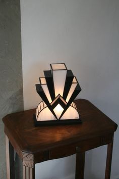 a table lamp sitting on top of a wooden table