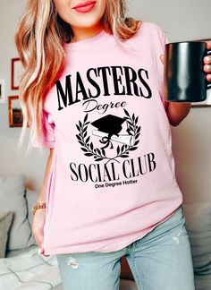 Masters Degree Social Club Shirt Welcome to our shop!   Please note the models shown in the pictures are wearing 1 or 2 sizes up, if this is your desired look, please keep sizing in mind.   All styles shown feature Comfort Colors C1717 an ultra-soft pigment dyed shirt featuring a comfy relaxed feel with 100% Cotton. Other details   .: 100% ring-spun cotton .: Heavy fabric (6.1 oz/yd² (206.8 g/m .: Relaxed fit .: Sewn-in twill label If you need any helping placing an order, please message me and College Cotton Shirt With Sublimation Print, Custom Print Pink Top For College, Pink Custom Print Top For College, Pink Graphic Print Shirt For College, Pink Crew Neck Shirt For College, Pink Cotton College Shirt, College Graphic Print Pink Shirt, College Shirt With Graphic Print In Pink, She Mastered It Graduation