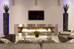 a living room with couches, chairs and a fire place in the fireplace area