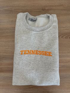 If you want a custom order or have any questions, please message me! -Tennessee embroidered crewneck -50/50 cotton/polyester -Unisex sizing: fits true to size. Order one size up for a looser fit. Fan Apparel Cotton Sweatshirt With Embroidered Graphics, Custom Embroidery Crew T-shirt For College, Custom Embroidered Crew T-shirt For College, Gray School Spirit Cotton Sweatshirt, College Crew T-shirt With Custom Embroidery, Gray Cotton Sweatshirt With School Spirit, Gray Cotton School Spirit Sweatshirt, Gray Cotton Sweatshirt For School Spirit, Team Spirit Embroidered Cotton Sweatshirt