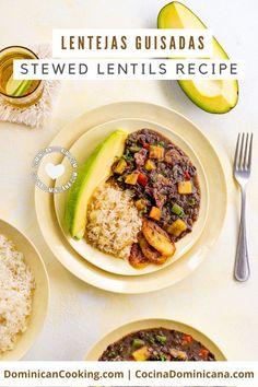 a white plate topped with food next to rice and an avocado