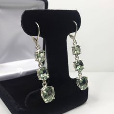 "Beautiful Green Spinel \"Tourmaline\" Leverback Earrings * Oval Cut Green Spinel \"Tourmaline\" measure 10x8mm, 8x6mm and 7x5mm each * 9.8cts total Gemstone weight * Leverback Fastening * Each measure 2 inches Long * Solid Sterling Silver Hallmarked & Gift Ready! Matching Pendant, Ring & Bracelet also Available! These Spinels are laboratory grown stones. They are identical to the genuine stone in every way, including chemistry, composition and hardness, with an outstanding cut, clarity Sterling Silver Gemstone Earrings For Formal Occasions, Formal Sterling Silver Earrings With Gemstone Accents, Sterling Silver Earrings With Gemstone Accents For Formal Occasions, Fine Jewelry Tourmaline Earrings For Formal Occasions, Tourmaline Earrings For Formal Occasions, Elegant Tourmaline Earrings For Formal Occasions, Formal Hallmarked Tourmaline Jewelry, Tourmaline Gemstone Earrings In Fine Jewelry Style, Elegant Tourmaline Jewelry For May Birthstone