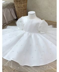 a white dress is sitting on a table