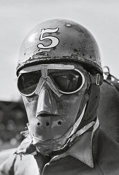 a man wearing a helmet and goggles with the number 55 on it's face