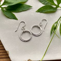 "Elegant, Light & Sparkly Double Hoop Earrings -- Beautiful with all of the milestone necklaces. These are perfect for everyday wear. ✦ All metal is bright sterling silver. ✦ Circles have been given a unique hammered texture, and are organically shaped. ✦ Each jump ring has been soldered closed for extra handmade quality. ✦ Earrings are 1 1/4\" long, including the french hook ear wires ✦ Largest circles are 5/8\" wide. See the larger version of these earrings: https://www.etsy.com/listing/158550 Double Hoop Earrings, Friend Jewelry, Circle Earrings, Ear Wires, Matching Earrings, Milestones, Minimalist Fashion, Simple Style, Jewelry Earrings Dangle