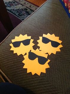 the sun and sunglasses are cut out from cardboard