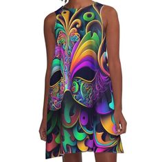 a women's dress with an abstract mask on it