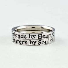 "This listing is for 2 stainless steel band ring, engraved with \"Friends by Heart\" and \" Sisters by Soul\" on the outside. It makes a very cute gift for best friends, forever sisters. Materials & Features: This ring is made of high quality hand polished solid stainless steel, which is hypoallergenic (good for metal-sensitive skin). Stainless steel will not tarnish, its luster and durability will make it last for many years. The black text on the ring will not fade out over time. Sizes: This r Heart Sisters, Bff Rings, Sisters Best Friends, Sister Rings, Matching Sisters, Soul Ties, Sisters By Heart, Friend Bff, Bff Gift