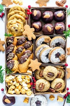 a box filled with lots of different types of cookies and pastries on top of a table