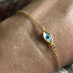 Tiny Evil Eye Bracelet Minimal Bracelet Evil Eye Bracelet | Etsy Gold Dainty Jewelry With Evil Eye, Dainty Gold Evil Eye Jewelry, Gold Evil Eye Dainty Jewelry, Handmade Gold Sterling Silver Chain Bracelet, Oval Tarnish Resistant Bracelet As Gift, Tarnish Resistant Oval Bracelet As Gift, Dainty Evil Eye Bracelet Jewelry, Gold Round Dainty Evil Eye Bracelet, 14k Gold Evil Eye Bracelet Gift