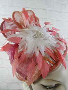 This one of a kind coral, pink and white fascinator hat is made completely by hand and is blocked over a wooden hat block. It would be a great hat for Kentucky Derby, Kentucky Oaks, Church or any spring or summer event. It is covered with a gorgeous wavy embroidered variegated striped fabric, an ombre sinamay bow, vintage velvet leaves and two-tone feather flower. I do all of the stitching by hand. An inner grosgrain headband helps it keep its shape and avoids damage from makeup. Mounted on a co White Handmade Mini Hats For Kentucky Derby, Handmade White Mini Hats For Kentucky Derby, Kentucky Oaks, White Fascinator, Velvet Leaves, Pink Fascinator, Hat Blocks, Feather Flower, Fascinator Hat