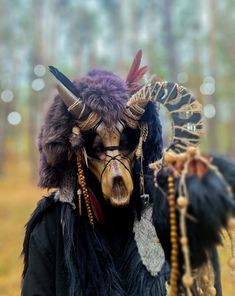 shaman's skull mask. the base is plastic, the fur is artificial. wooden decor, feathers, ropes, leather. universal size, suitable for everyone, put on with the help of an elastic band. the set includes a mask with decor, beads and fur pads on the hands. Ram Skull Mask, Deer Skull Mask, Wicker Man, Ram Skull, Pagan Rituals, Feather Headpiece, Halloween Candy Bags, Skull Mask, Bone Jewelry