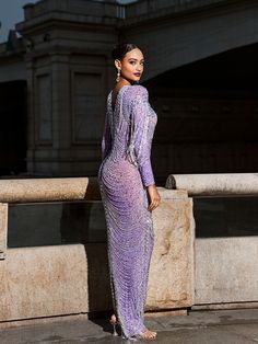 This Kaede Crystal Chain Fringe Mesh Maxi Dress is a show-stopping piece that will add a touch of dazzle to any special occasion. The mesh fabric is adorned with chains and crystals, creating a beautiful fringe effect that adds movement and texture to the dress. The purple color adds a regal and sophisticated touch, making this dress a must-have for any fashion-forward individual.    Material: 100% Polyester    Invisible zipper opening at the back   Stretch Factor:  Low   Stretch    Clean: Dry c Glamorous Beaded Fringe Evening Dress For Formal Events, Glamorous Evening Dress With Beaded Fringe For Formal Occasions, Glamorous Formal Evening Dress With Beaded Fringe, Glamorous Floor-length Evening Dress With Rhinestone Fringe, Gala Evening Dress With Beaded Fringe For Party Season, Elegant Beaded Fringe Evening Dress For Prom, Elegant Evening Dress With Beaded Fringe For Prom, Glamorous Floor-length Dress With Beaded Fringe, Elegant Beaded Fringe Evening Dress