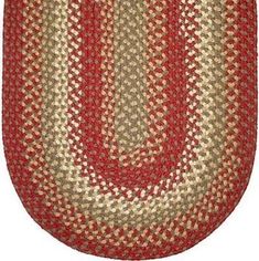 a red and beige rug with an oval design on the bottom, in front of a white background