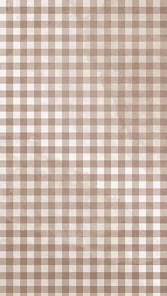 a brown and white checkered pattern is shown on the wall in this image, it appears to be grungy