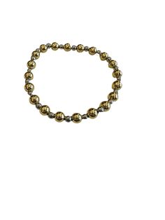 Indulge in the ultimate wrist candy with our Two Tone Beaded Bracelet. Adorned with 6mm polished gold beads and 4mm polished silver beads alternating, this bracelet exudes sophistication and luxury. Its stretch cord design ensures a perfect fit for up to a 7" wrist, making it perfect for stacking with your other favorite pieces. Elevate your accessory game with this exclusive and tasteful bracelet. Gold Double Strand Bracelets With Faceted Beads, Gold-tone Polished Bracelet, Adjustable Gold-tone Link Bracelet, Gold Multi-strand Polished Beaded Bracelets, Two Tone Bracelet, Hobo Style, Buckle Bracelet, Wrist Candy, Polish Silver