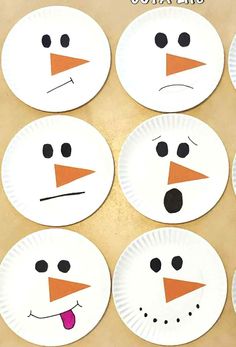 paper plates with snowmen painted on them