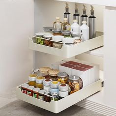 two tiered spice rack with spices and condiments in the bottom section, open on both sides