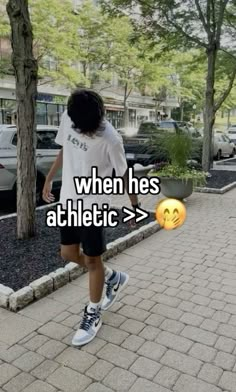 a person walking down the street with an emoticive expression on their face that says, when hes athletic > >