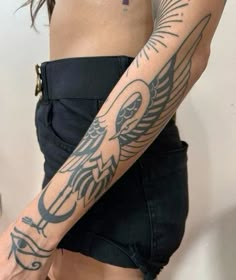 a woman with a cross tattoo on her arm